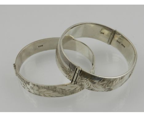 A silver cuff bangle, having engraved decoration, together with another, and a pair of Charles Horner silver earrings of quat