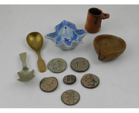 A Delft blue and white pottery pickle dish, together with a plated caddy spoon, a brass caddy spoon, assorted reproduction co