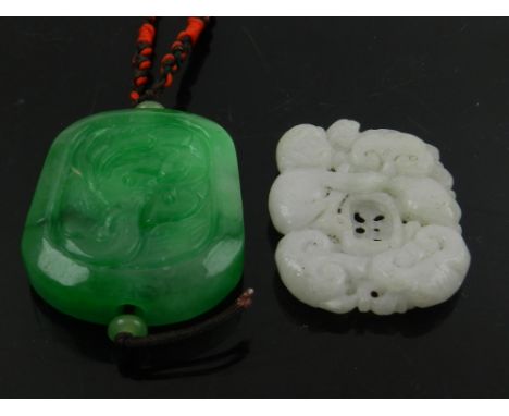 A Chinese carved pierced jade pendant decorated with a monkey among flowers, together with another similar (2)