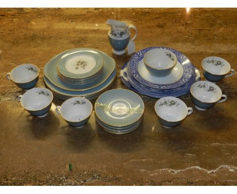 A Royal Doulton six piece tea service pattern 'Rose Elegance', decorated with sprays of flowers within gilt and light blue bo