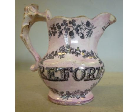 An early/mid 19thC tinted pink lustre glazed pearlware 'Political' jug of bulbous form, decorated in monochrome with a portra