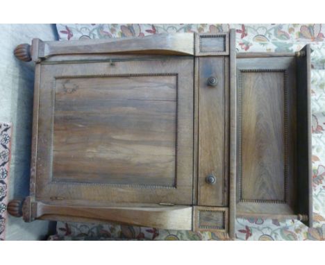 A William IV bleached rosewood chiffonier with carved, bead bordered ornament, the panelled back superstructure featuring a g