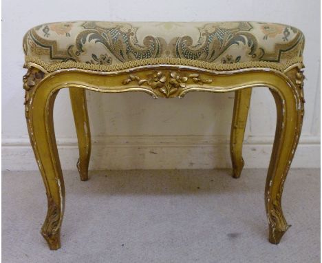 A late 19thC French giltwood framed rectangular stool, the overstuffed, braided and floral tapestry upholstered seat stamped 