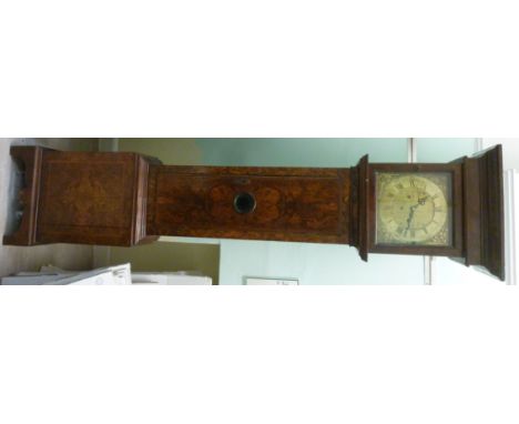 An 18thC and later, figured walnut veneered longcase clock, the hood having a cushion moulded pediment, over a glazed, panell