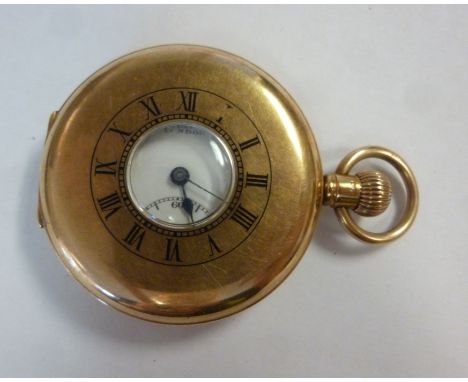 A 9ct gold cased half hunter pocket watch with black enamelled Roman numerals around the bullseye window, the keyless movemen