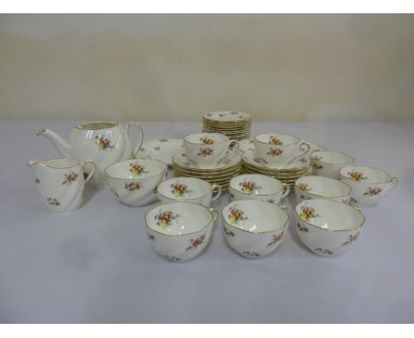 Coalport tea service retailed by Thomas Goode of London with a floral pattern against a white ground and gilt edging (41)
