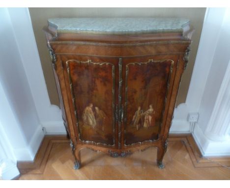 A French inlaid Kingswood commode with painted hinged double doors and applied brass mounts with marble top, on cabriole legs
