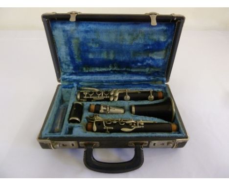 A French 1920s b flat wooden clarinet by Cabatt Paris to include a Henri Selmer mouthpiece all in fitted case
