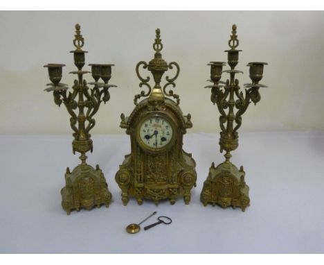 French spelter mantle clock set two train movement, enamel dial, Arabic numerals, with flanking five light candelabra, to inc