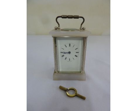 Marble and brass carriage clock of customary form to include key