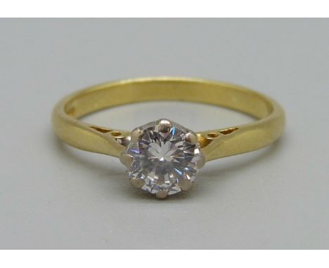 An 18ct gold solitaire diamond ring, approximately 0.57ct diamond weight, 2.4g, M 