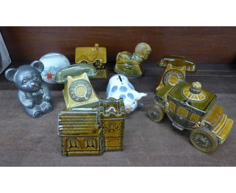 A collection of vintage money boxes including Szeiler, Royal Doulton Bunnykins, etc. 