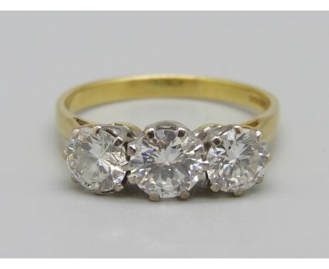 An 18ct gold and diamond trilogy ring, approximately 1.70ct diamond weight, 3.0g, O 