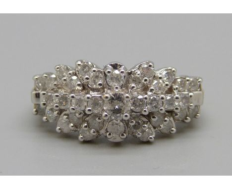 A 9ct gold thirty-five stone diamond ring, approximately 1.1ct, 5.5g, P, boxed 