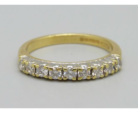 An 18ct gold diamond half eternity ring, 3.6g, O 