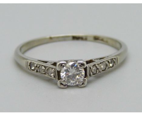 A platinum and diamond ring set with diamond shoulders, 1.8g, N 