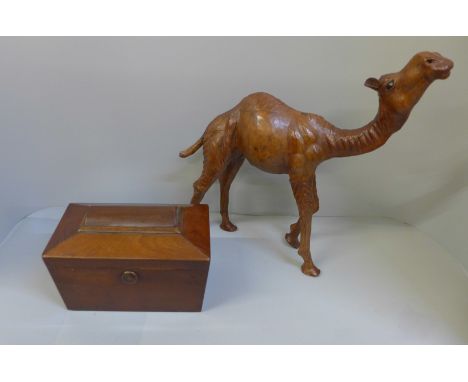 A Liberty of London leather model of camel (stamped) and a Georgian sarcophagus wooden tea caddy 