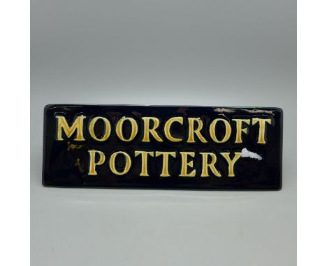 A Moorcroft Pottery retailers ceramic sign 