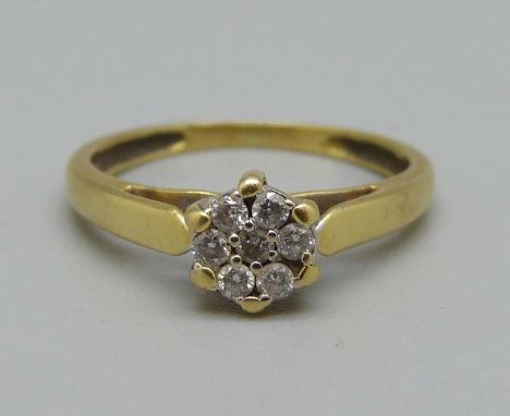 A yellow metal and diamond daisy cluster ring, 2.5g, K 