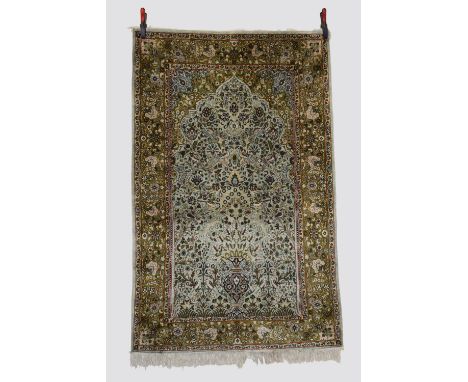 Three Kashmiri silk rugs, north India, modern production, the first a prayer rug, 6ft. X 3ft. 10in. 1.83m. X 1.17m. Pale gree