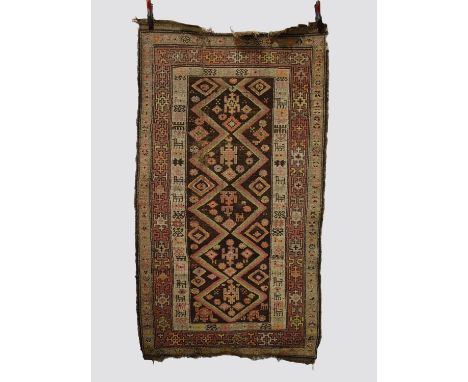 Four rugs comprising: the first: Kurdish rug, north west Persia, circa 1930s, 6ft. 7in. X 3ft. 8in. 2.01m. X 1.12m. Overall w