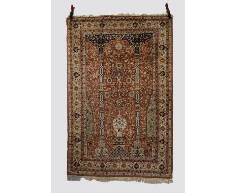 Kashmiri prayer rug, north India, mid-20th century, 6ft. 3in. x 4ft. 1in. 1.91m. X 1.25m. Slight loss to flatweave ends. Rust