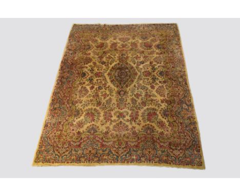 Kerman carpet, south east Persia, first half 20th century, 12ft. 1in. X 9ft. 3.68m. X 2.75m. Overall wear with areas of moth 