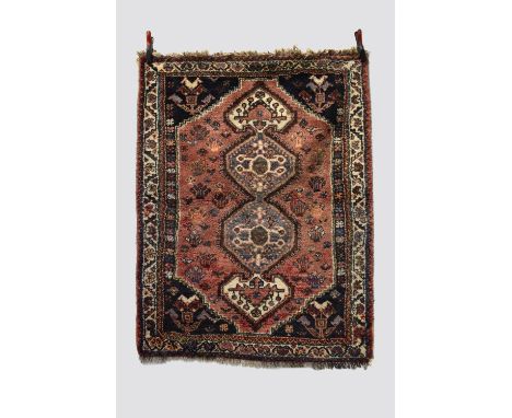 Two rugs: the first: Fars rug, Shiraz area, south west Persia, mid-20th century, 5ft. 4in. X 4ft. 1in. 1.63m. X 1.25m. Hole t