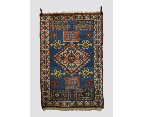 Two rugs: the first, Kars Kazak rug, east Anatolia, second half 20th century, 6ft. 6in. X 4ft. 4in. 1.98m. x 1.32m. Pale blue