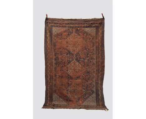 Three rugs; the first a rug by the Baharlu tribe of the Khamseh Confederation, Fars, south west Persia, early 20th century,  