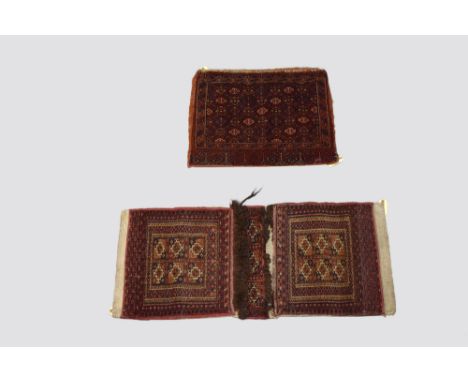 Two Turkmen khorjins, circa 1930s; the first a Tekke double khorjin,  3ft. 5in. X 1ft. 6in. 1.04m. X 0.46m. Six panelled guls