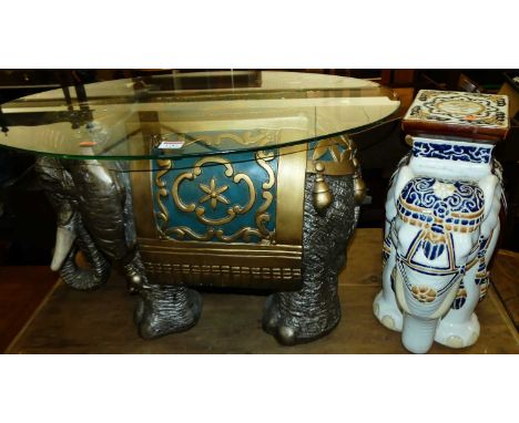 A contemporary glass topped oval occasional table, the base in the form of a saddled Indian elephant, length 75cm, together w