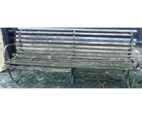 A 19th century wrought iron framed and wood slatted four seater garden bench (for restoration), length 214cm