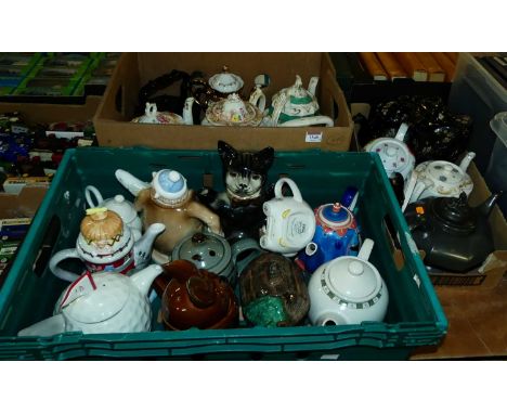 Three boxes of various novelty ceramic teapots and others
