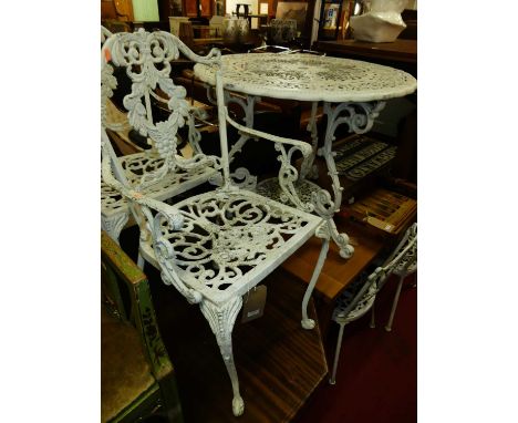 A galvanised Victorian style and later white painted circular garden table, dia.92.5cm; together with a similar set of four c