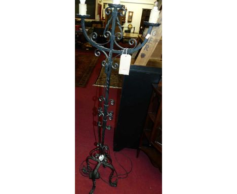 A wrought iron freestanding triple branch floor light, height 160cm