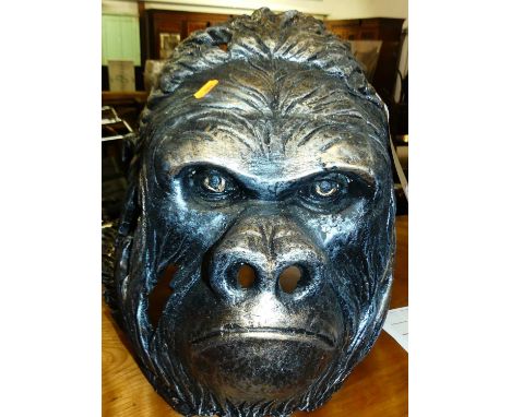 A contemporary spray-painted ceramic model of a gorilla's head, h.39cm
