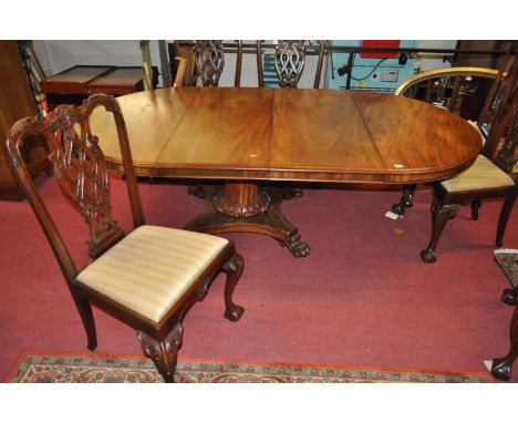 A mahogany D-end extending dining table, having pull-out action and two extra drop-in leaves, raised on octagonal column to q