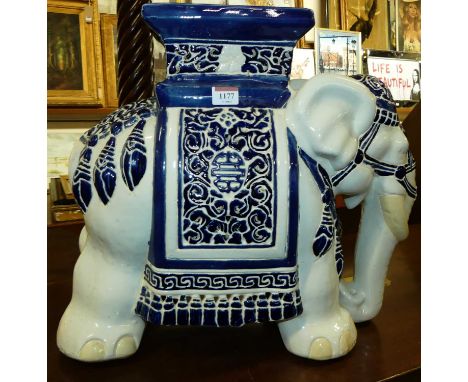 A contemporary Chinese glazed ceramic elephant form plant stand, height 43cm, length 50cm