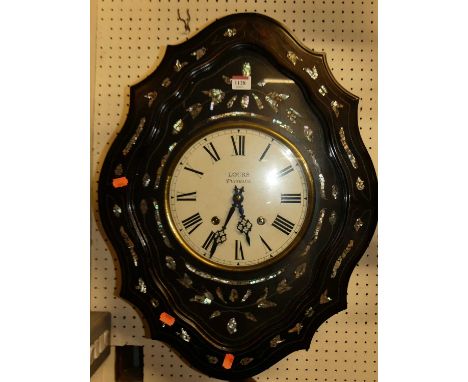 A late 19th century French ebonised and wired metal and mother of pearl inlaid shaped vineyard wall clock, the painted white 
