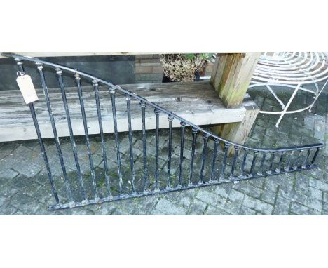 A black painted wrought iron single railing of shaped tapering form, 88 x 195cm
