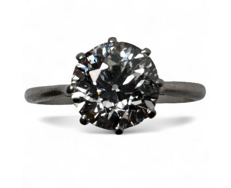 An old European cut diamond solitaire ring.  In a white precious metal mount, assessed as platinum.  Stone colour assessed as