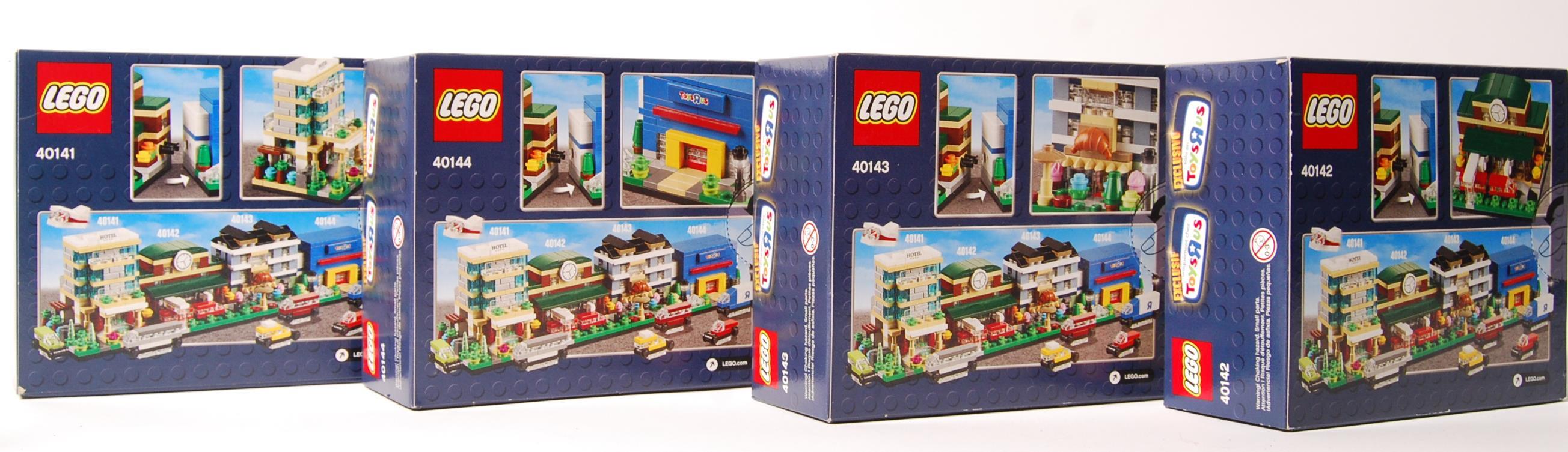 A collection of 8 x Lego Toys R Us exclusive mini modulars boxed sets