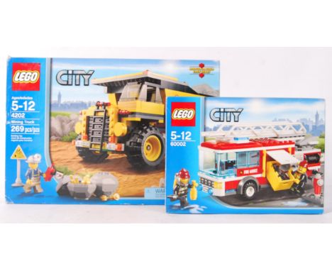 Two Lego City boxed sets to include; No. 60002 ' Fire Engine ' and No. 4202 ' Mining Truck ' Vendor assures us resealed sets 