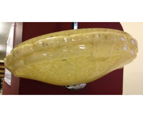A large Art Deco ceiling light with yellow mottled glass shade.