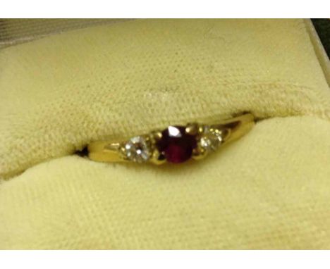 A 9ct gold 3 stone diamond & ruby ring - size L