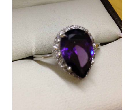 Ladies 925 silver dress ring with large teardrop amethyst stone approx 2.0ct, surrounded by small crystals. Size O.