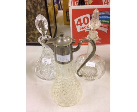 2 cut glass decanter and a claret jug.