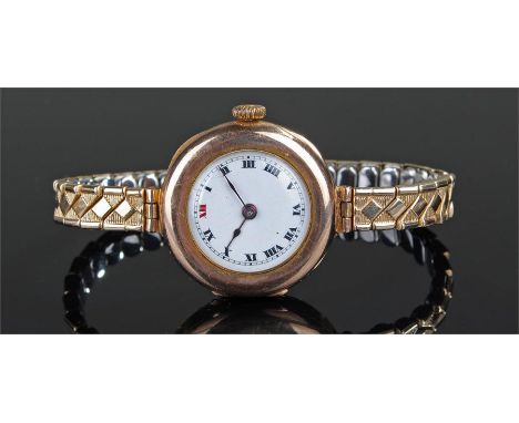 9 carat gold ladies wristwatch, with a white enamel dial, gold plated elasticated strap, case 26mm diameter