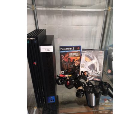 Playstation 2 console with 2 games and controller . 